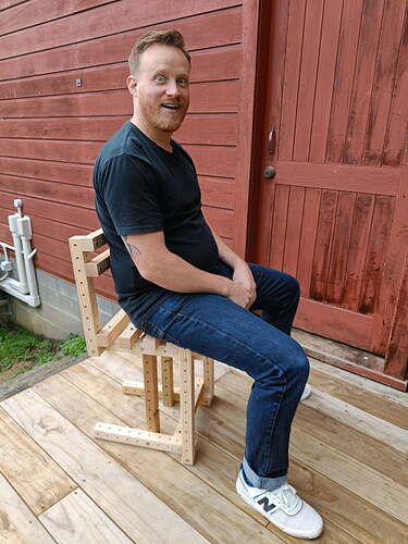 me-sitting-on-grid-beam-chair
